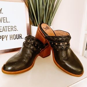 Black studded clogs
